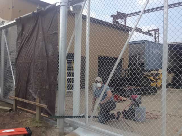 Residential metal gate on driveway with gate operator