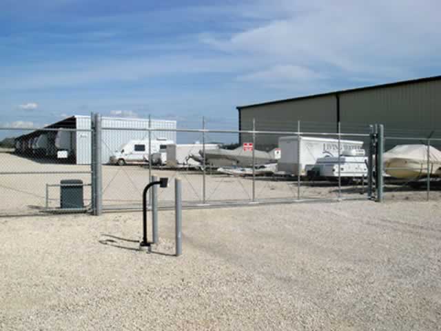 Metal fence with custom horse element and gate operator